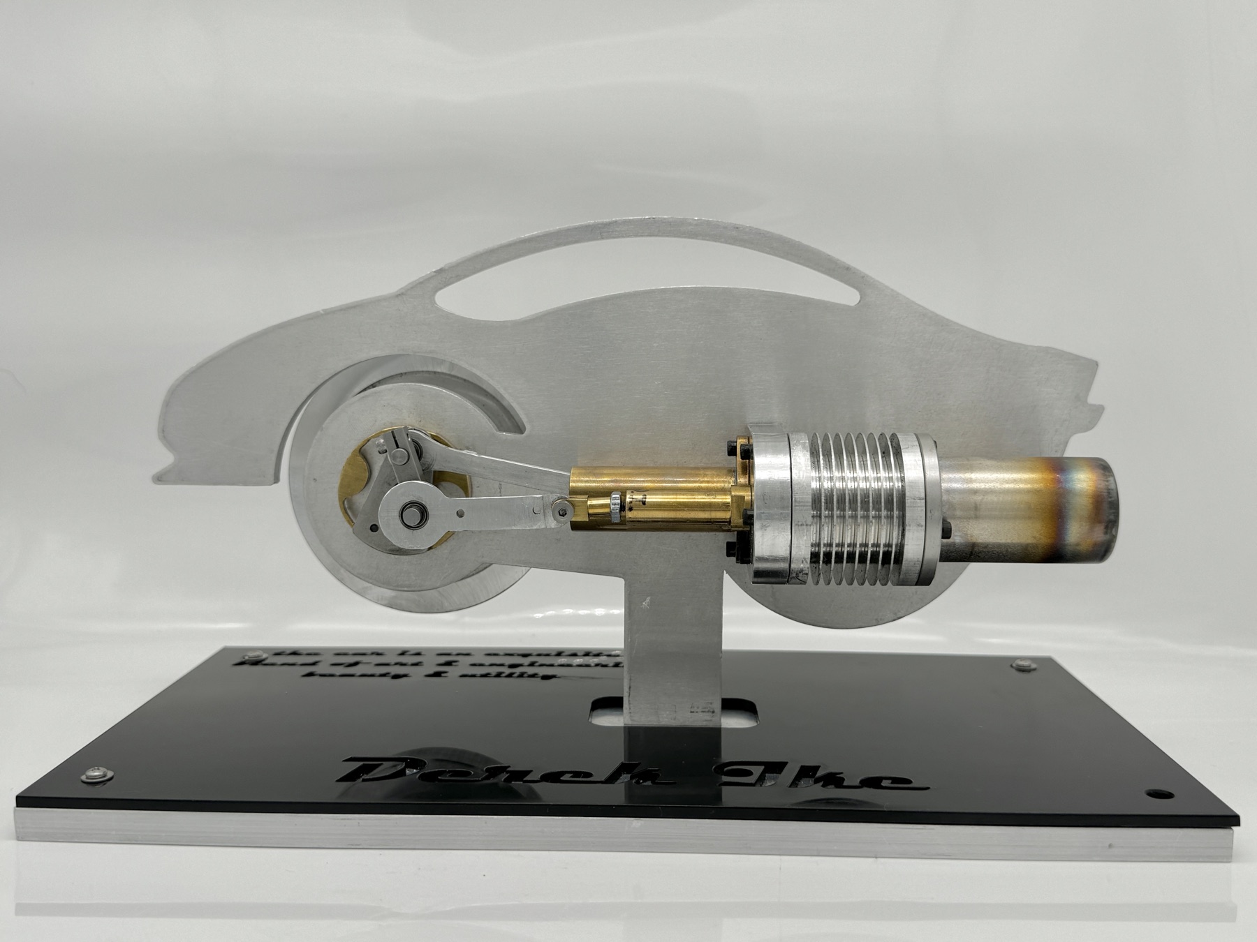 Stirling engine on its laser-cut sports-car bedplate
