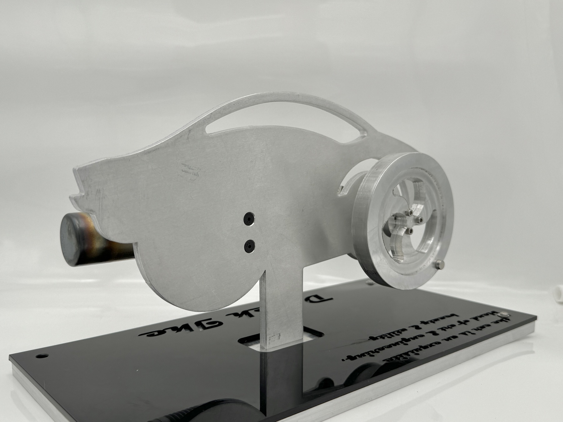 Detail of the brass power cylinder, connecting rod, and finned aluminum heat sink